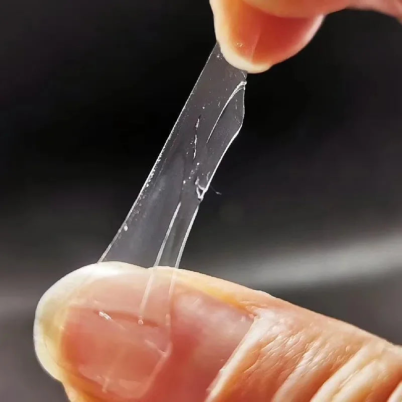 Adhesive jelly nail tab being applied to a fingernail