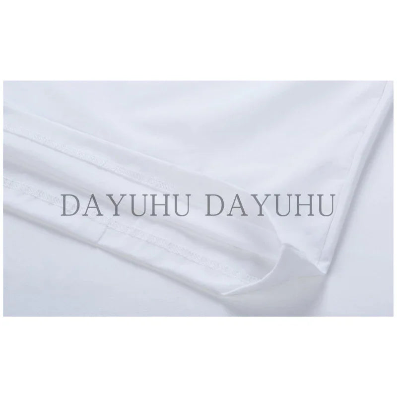 Close up view of the hem of a white t-shirt showing stitching