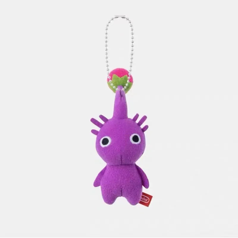 A small purple plush doll keychain with a flower bud on its head