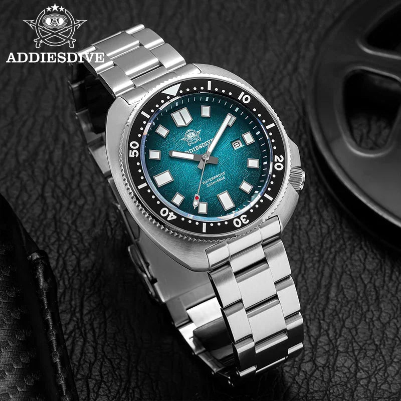 Stainless steel diver watch with a textured blue dial on a black background