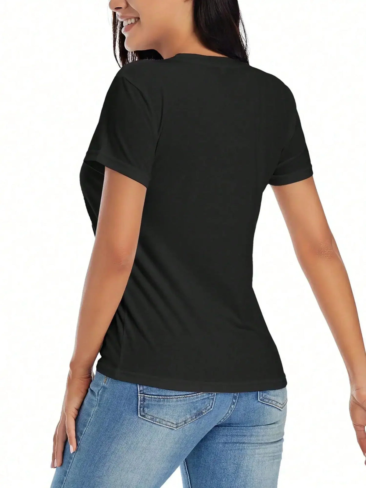 The back view of a woman wearing a plain black t-shirt paired with blue jeans.