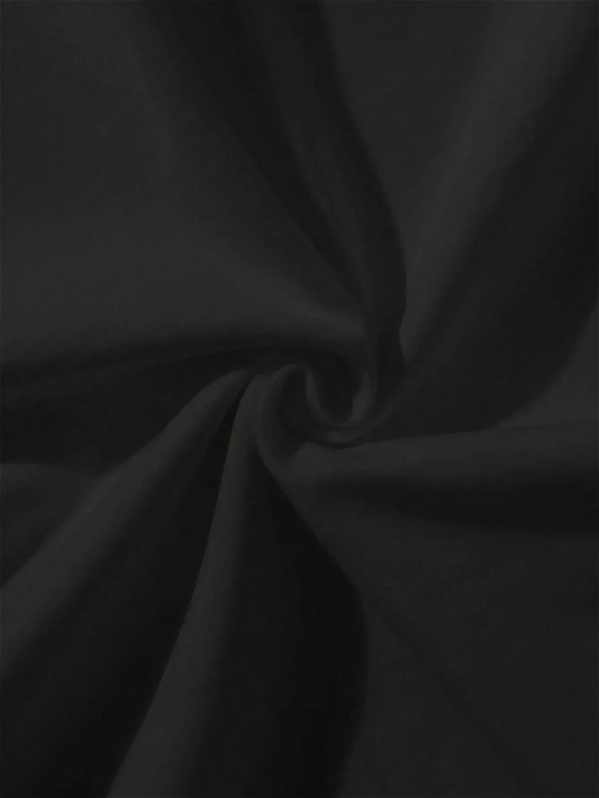 Close-up of gathered black textile material