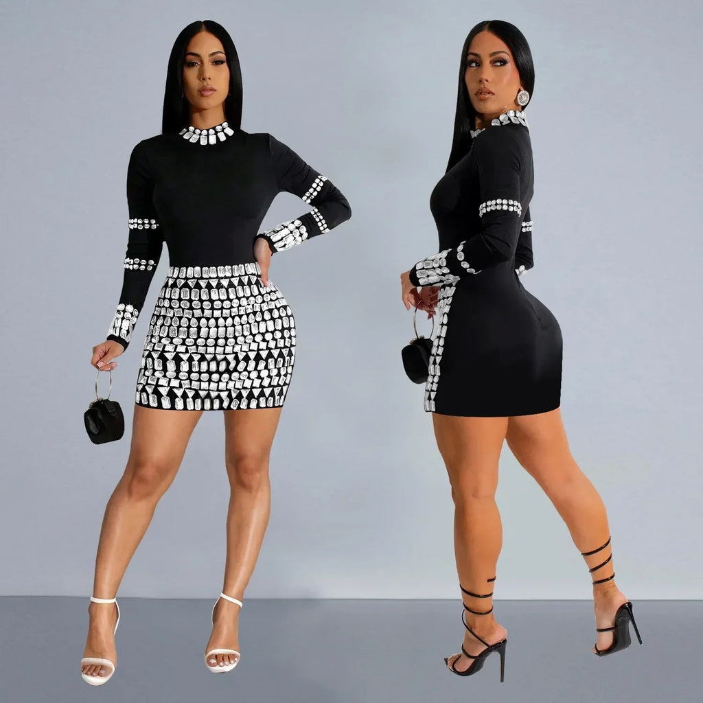 Model wearing a black mini dress with silver rhinestone embellishments in front and side views.