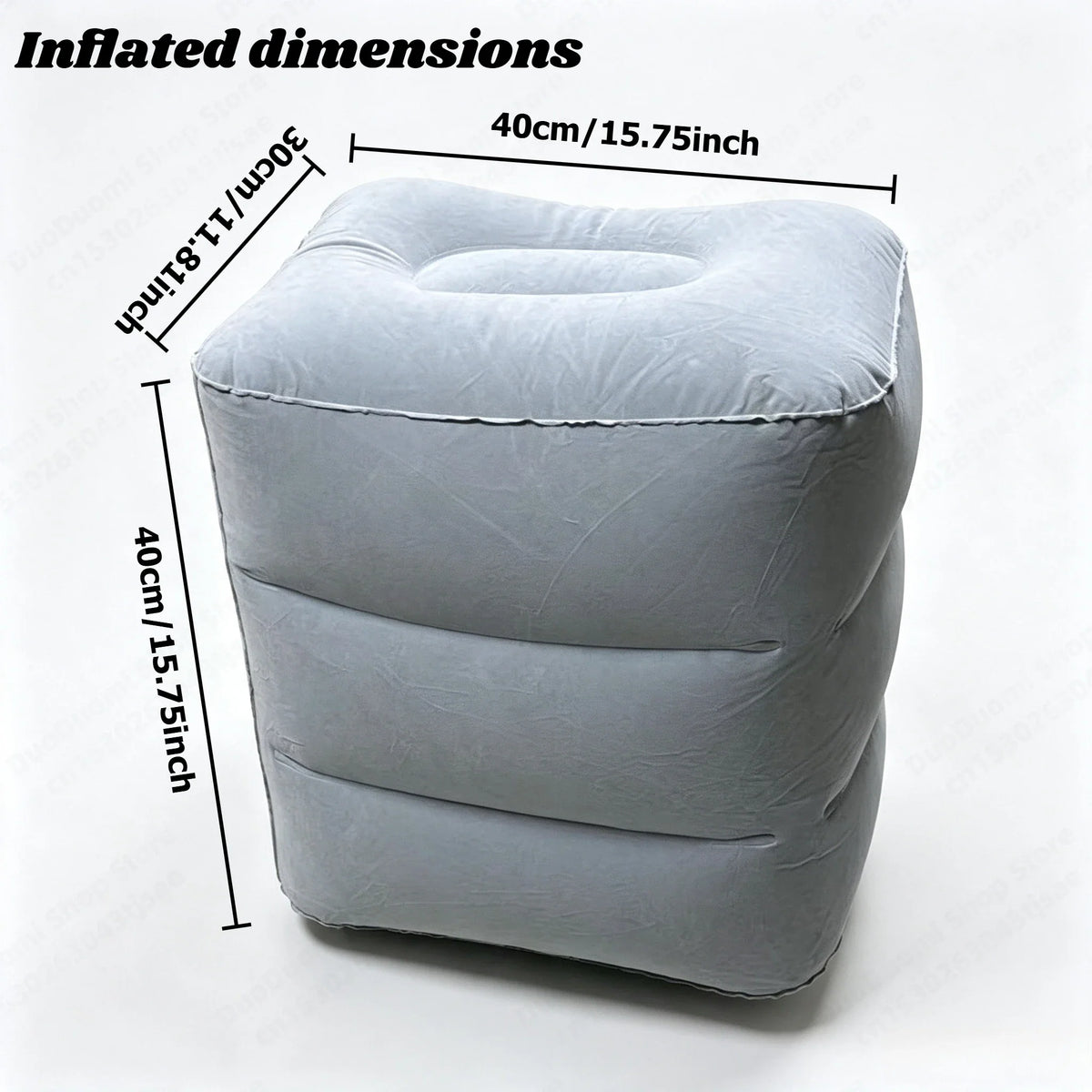 Grey inflatable footrest with dimensions in centimeters and inches labeled
