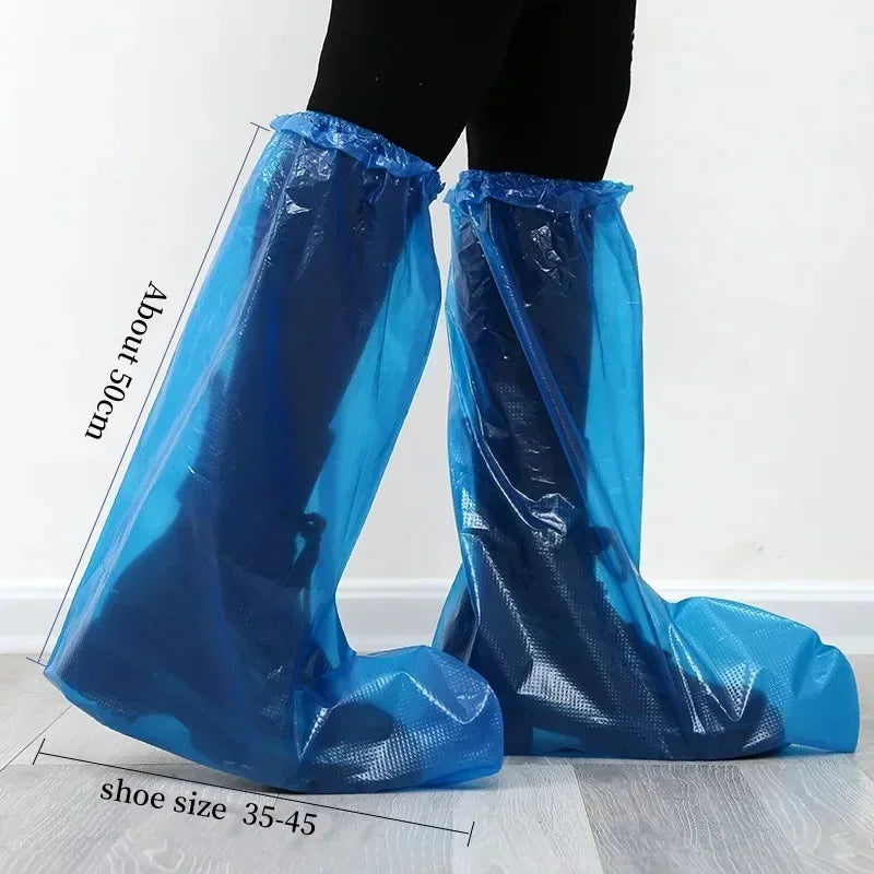 Person wearing tall blue disposable plastic rain shoe covers on legs