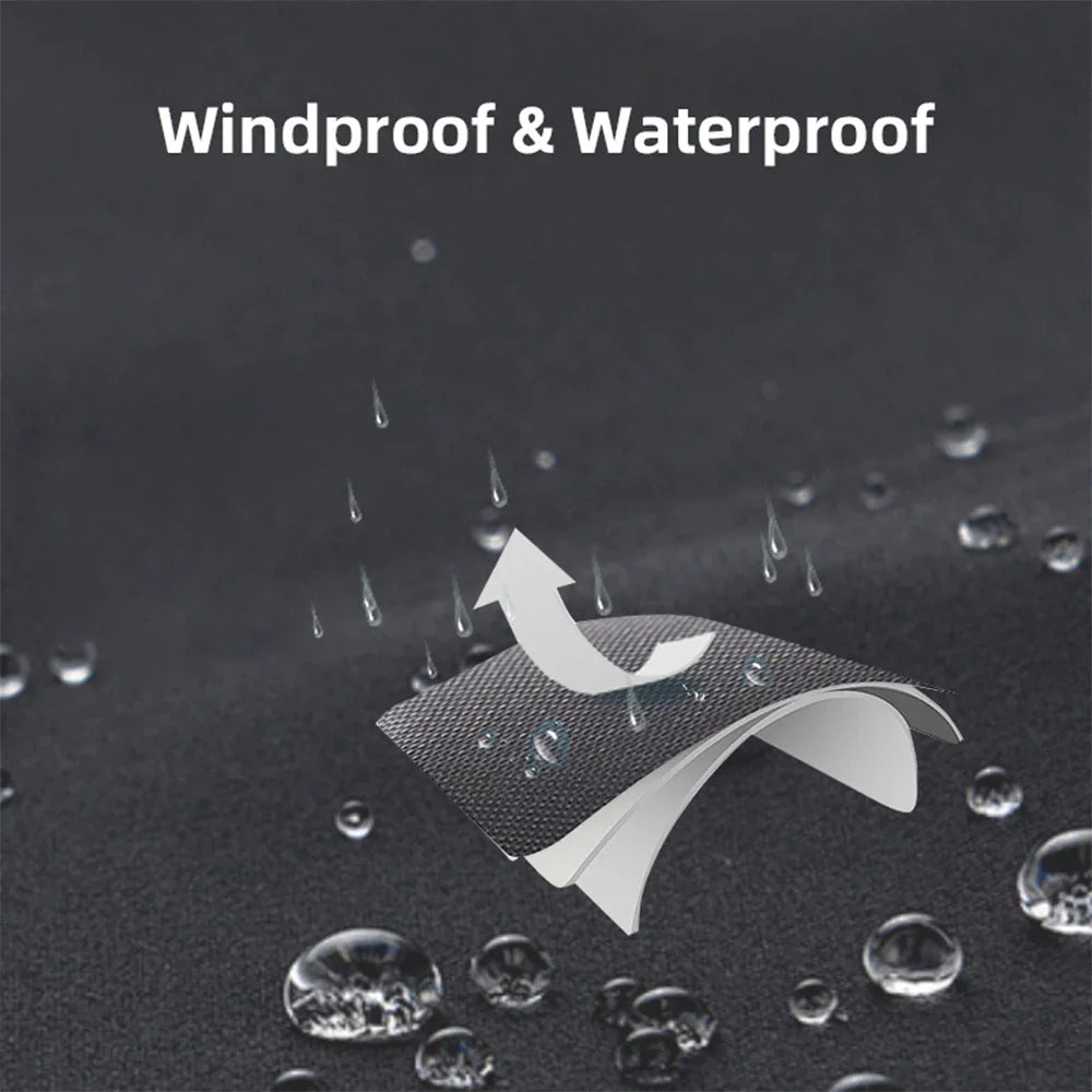 Close-up view of water droplets on waterproof black fabric.