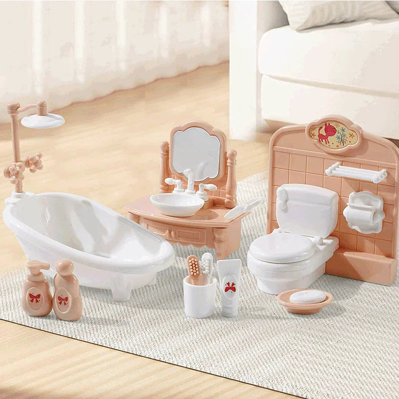 Miniature bathroom furniture set with bathtub, sink, toilet, and accessories.