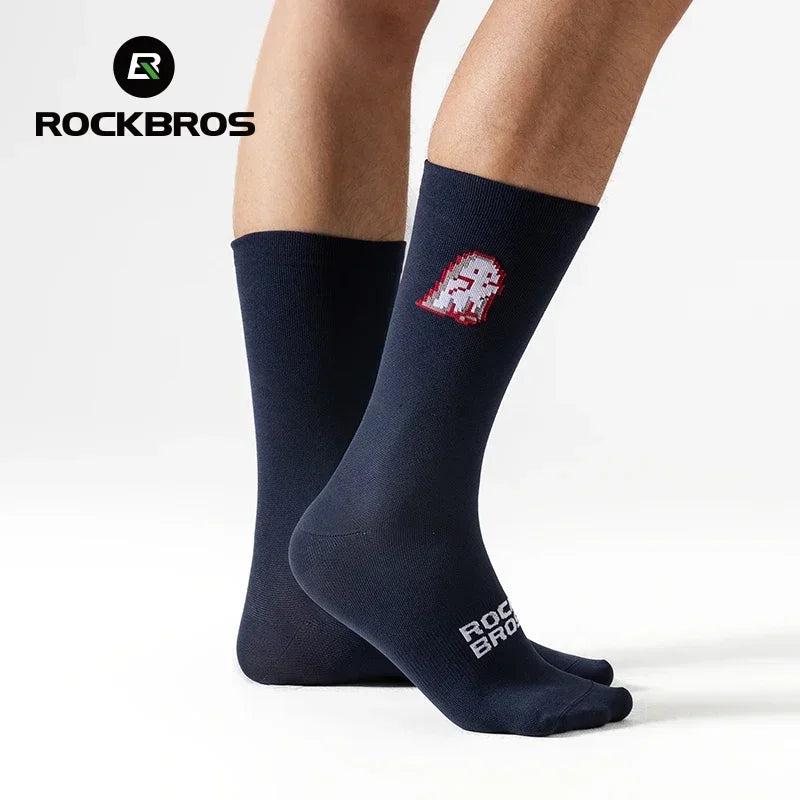 Navy athletic socks with a small pixel ghost graphic worn on feet