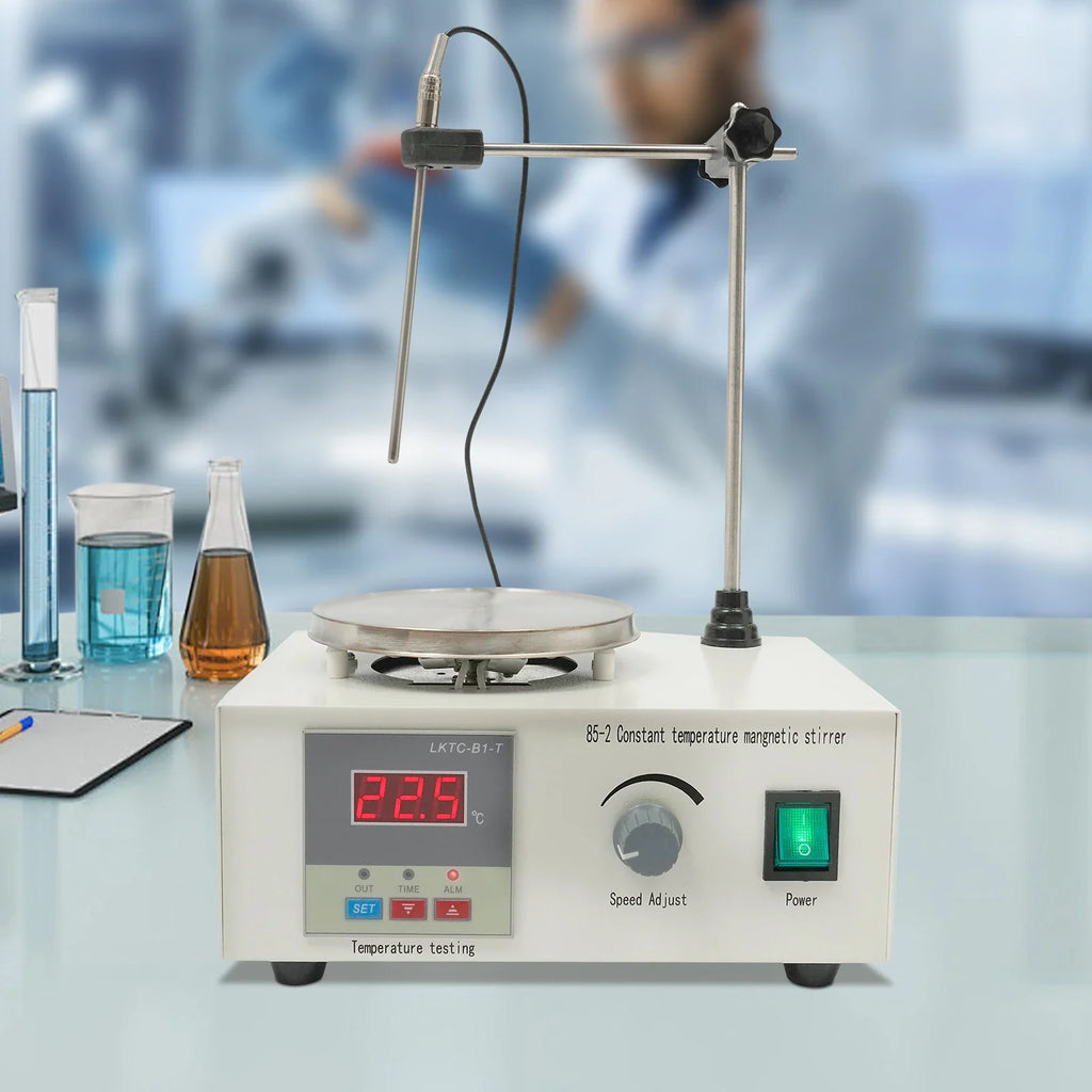 Magnetic stirrer with digital temperature display and heating plate in a laboratory setup with glassware