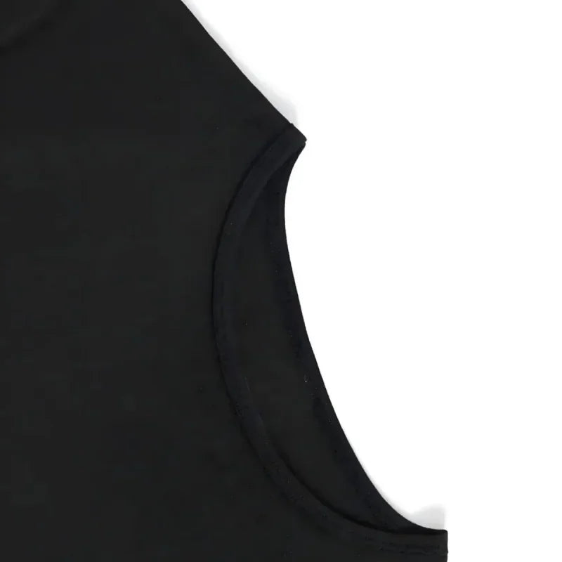 Close-up of the sleeve and shoulder seam of a black t-shirt.