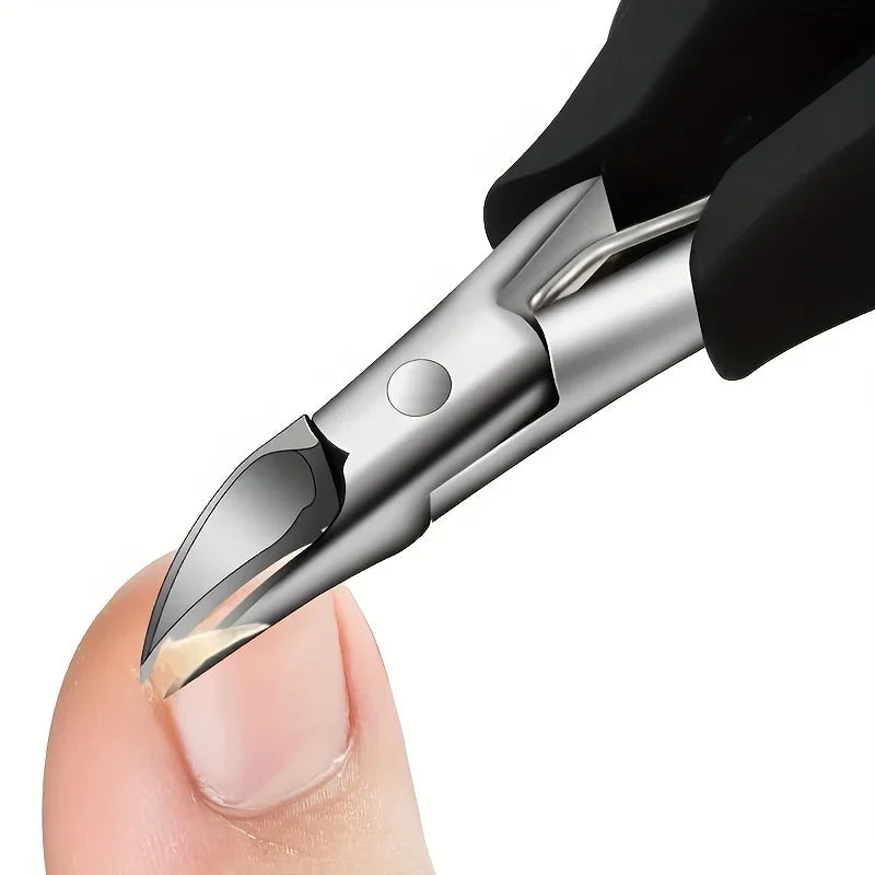 Stainless steel nail nippers cutting a toenail close up