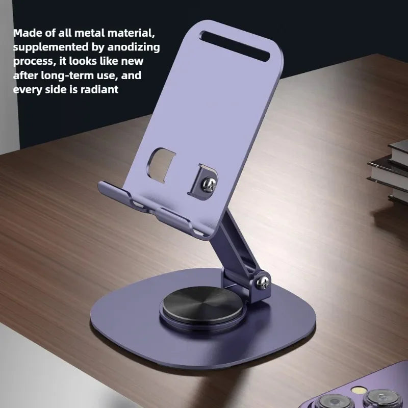 Anodized metal desktop stand for phones and tablets on a wooden table.