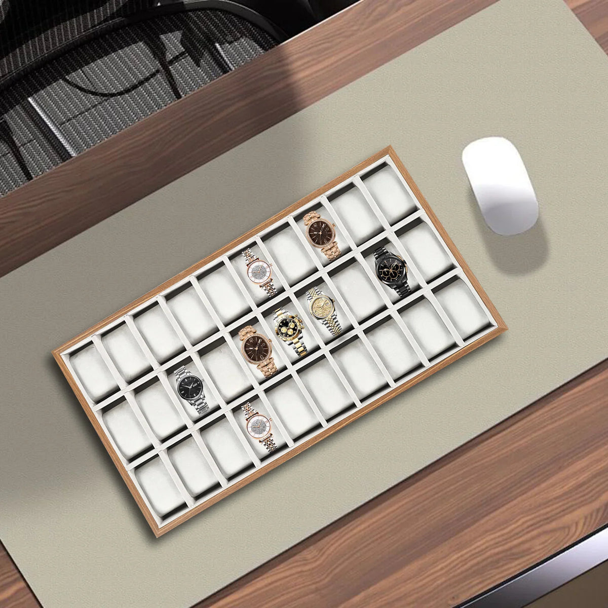 30-slot wooden watch display tray on desk with a computer mouse