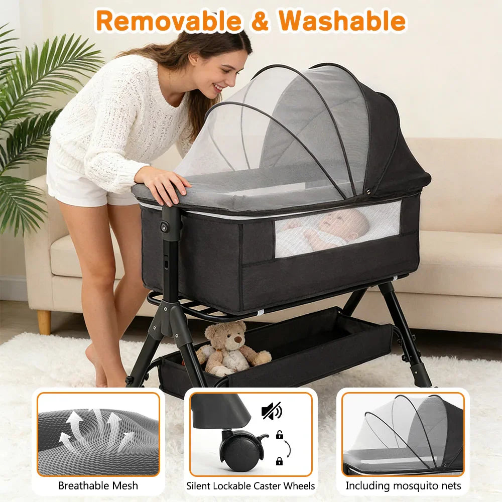 A woman next to a grey portable baby bassinet highlighting features like removable fabric, mesh panels, and lockable wheels.