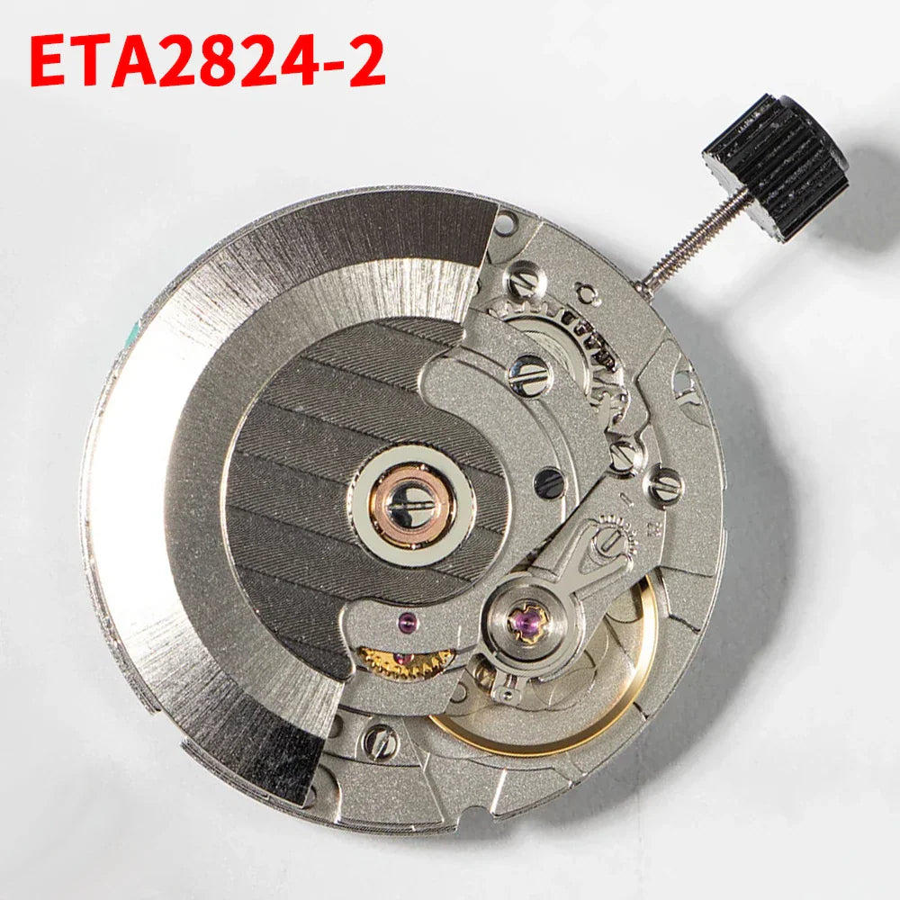 Top-down view of a mechanical watch movement showing the gears, balance wheel, and winding stem.