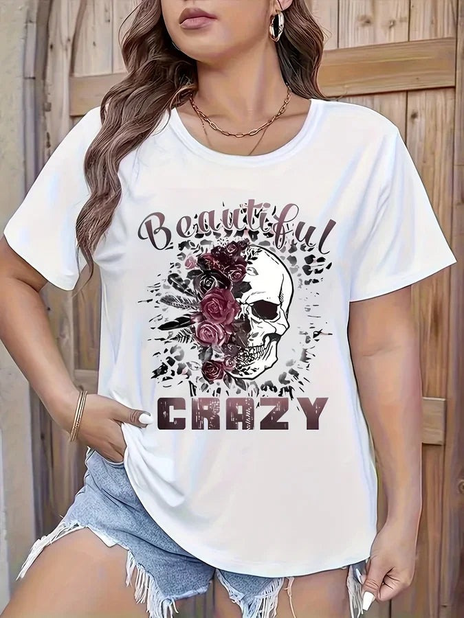 White short sleeve t-shirt with floral skull graphic and text on a woman