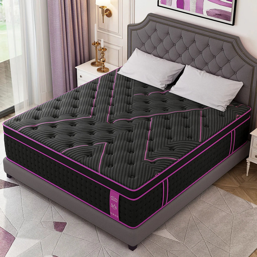 An angled view of a thick hybrid mattress with a black and purple cover on a bed frame.