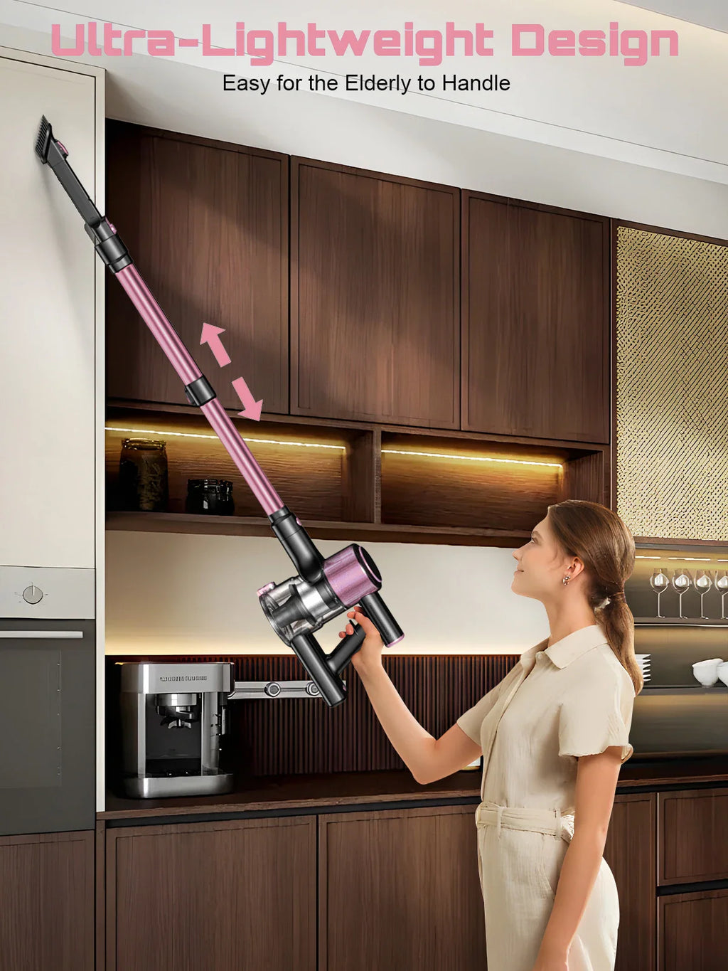 Woman using a lightweight pink and black cordless stick vacuum cleaner to reach high kitchen cabinets