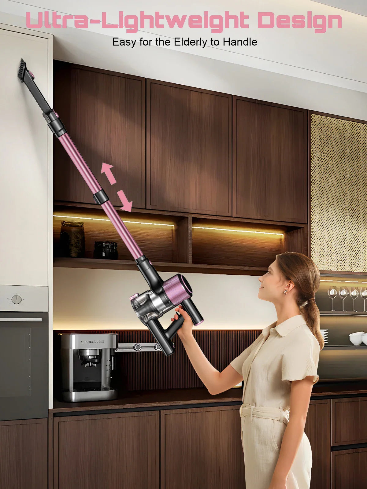 Woman using a lightweight pink and black cordless stick vacuum cleaner to reach high kitchen cabinets