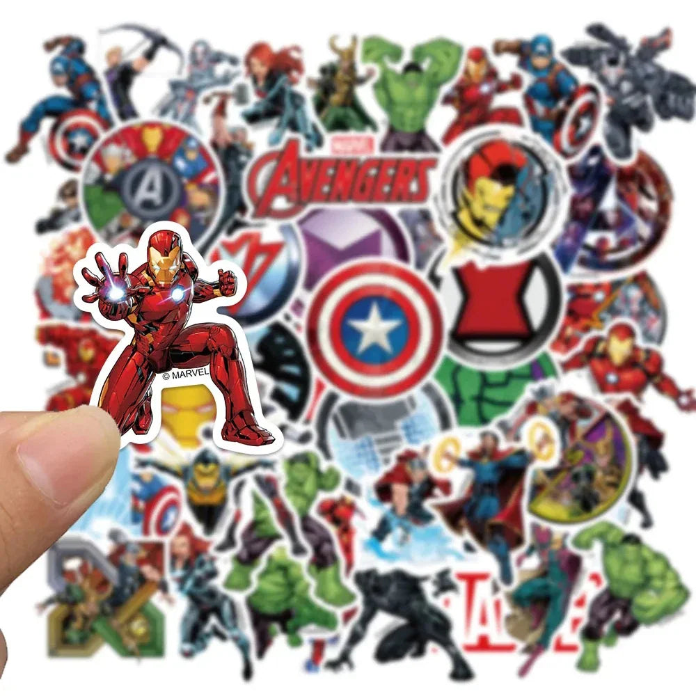 A hand holding an Iron Man superhero sticker with other character stickers in the background