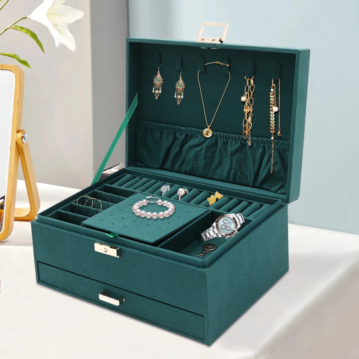Dark green suede 3-tier jewelry box organizer featuring velvet lining, necklace hooks, and various compartments