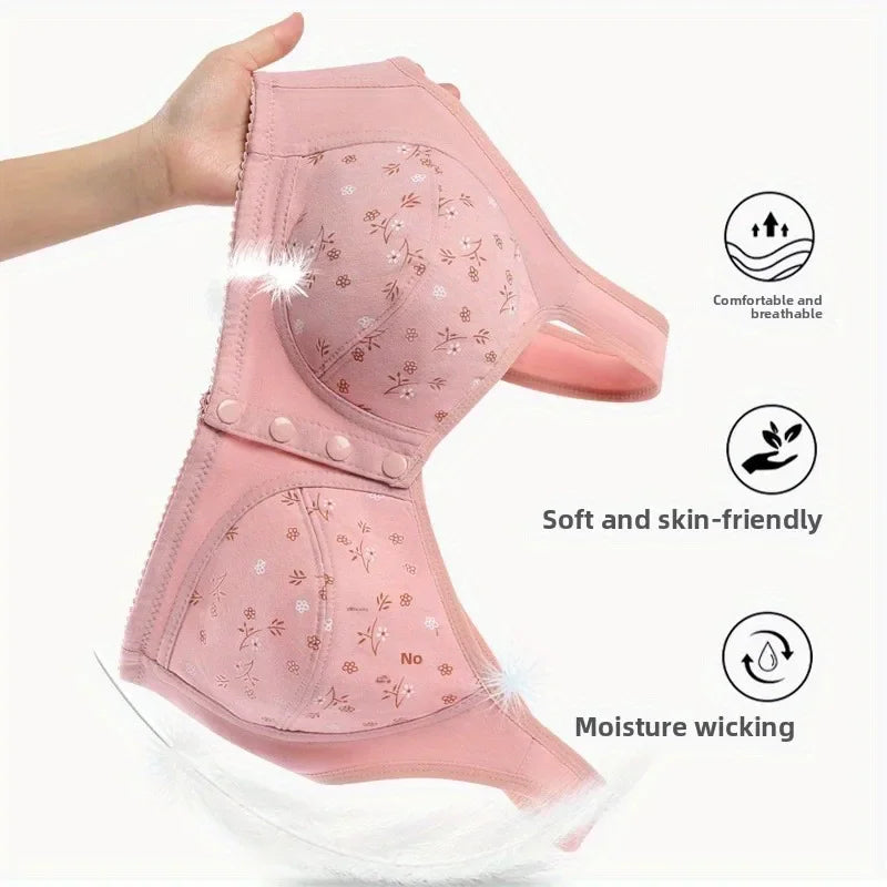 A hand holding up a pink floral bra, highlighting its breathable and moisture-wicking material