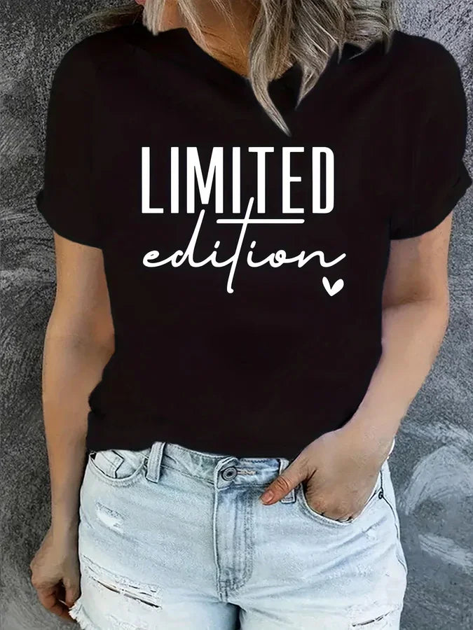 Black women's round neck t-shirt with Limited Edition text and heart graphic worn by a person