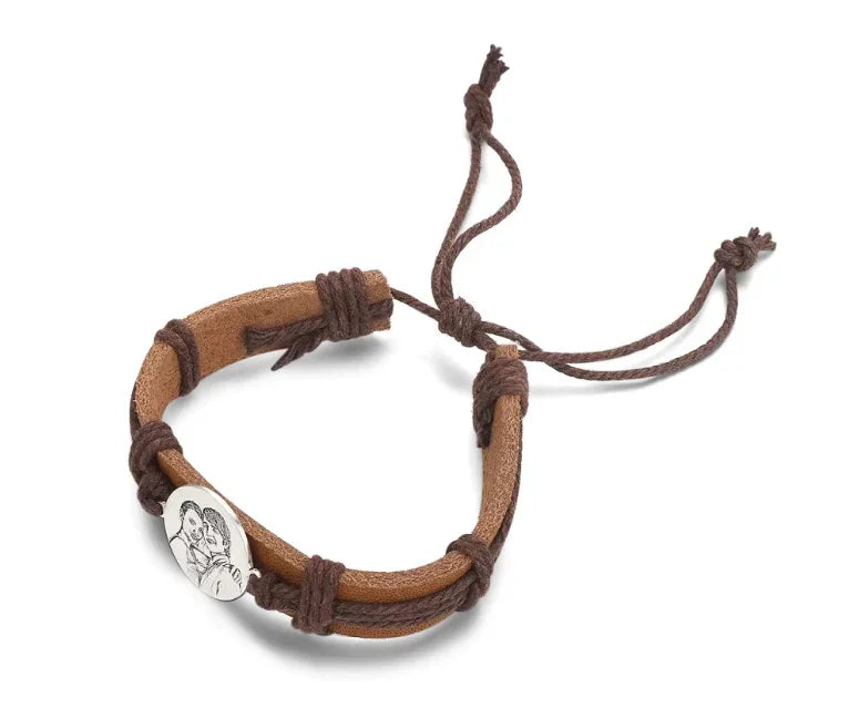 Brown leather bracelet with a circular stainless steel charm showing an engraved photo of a couple.