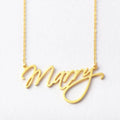 Gold custom script name necklace hanging on a chain