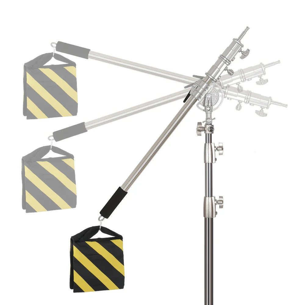 Telescopic boom arm for studio lighting with counterweight sandbag and pivot joint