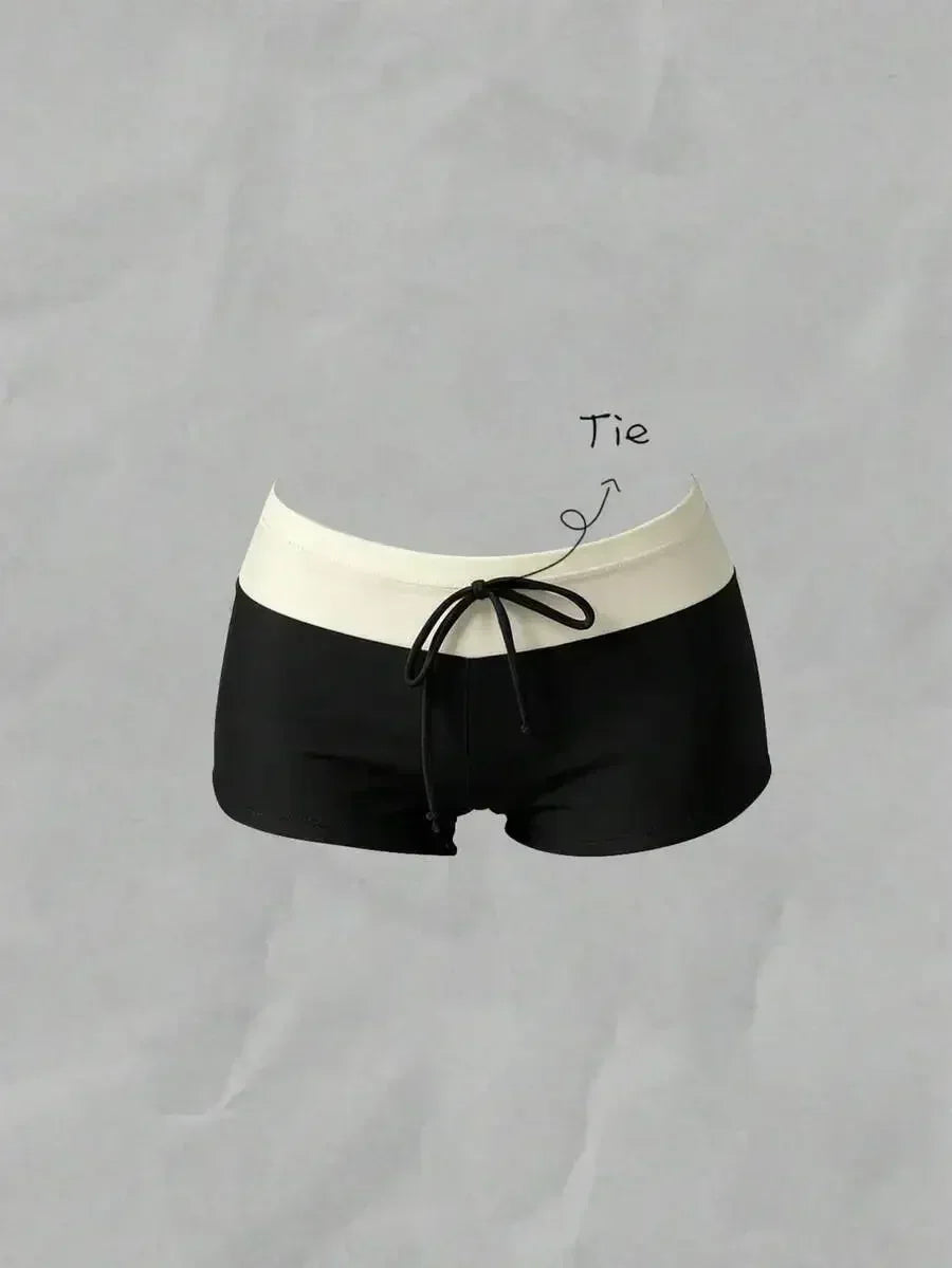 Black high waisted bikini bottoms with a white waistband and drawstring detail