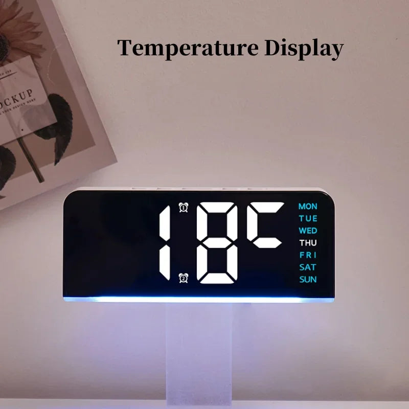 Digital LED alarm clock showing current temperature display