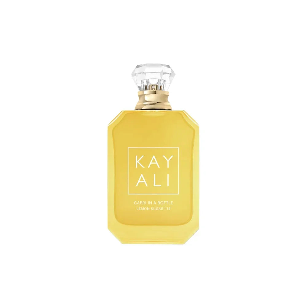 Bottle of lemon sugar scented perfume against a white background