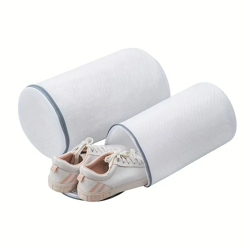 White cylindrical mesh shoe washing bags for sneakers.