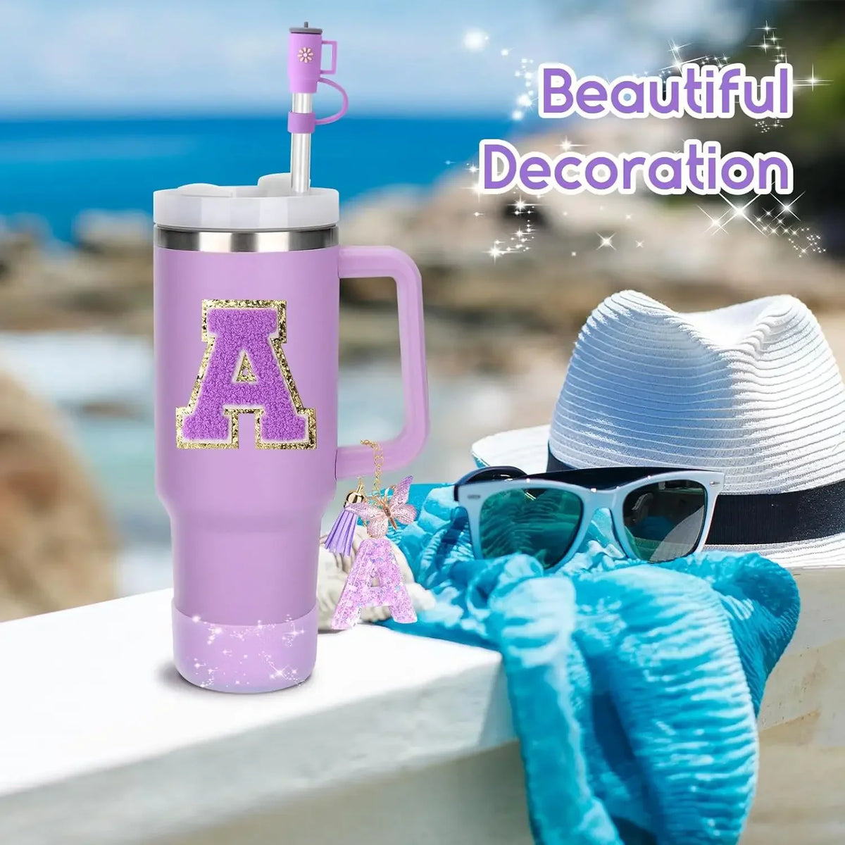 Purple tumbler with initial A patch, butterfly charm, and straw topper standing on a railing.