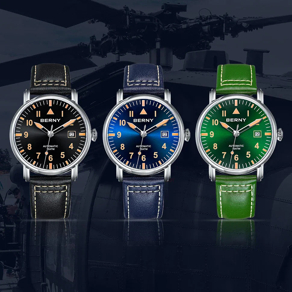 Three aviation-style automatic watches with leather straps in black, blue, and green