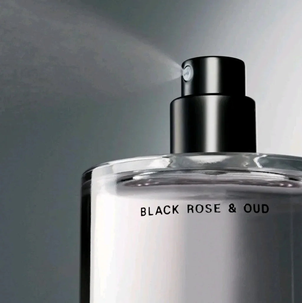 Close up of a fragrance mist spray nozzle emitting a fine mist