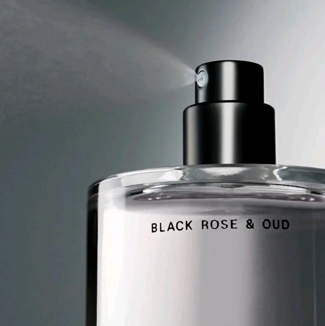 Close up of a fragrance mist spray nozzle emitting a fine mist