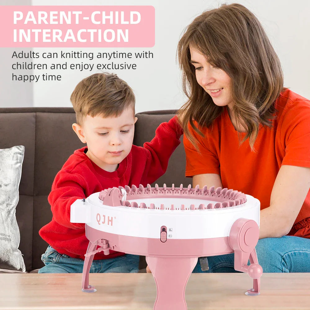 A woman and a young boy knitting together with a round knitting machine.