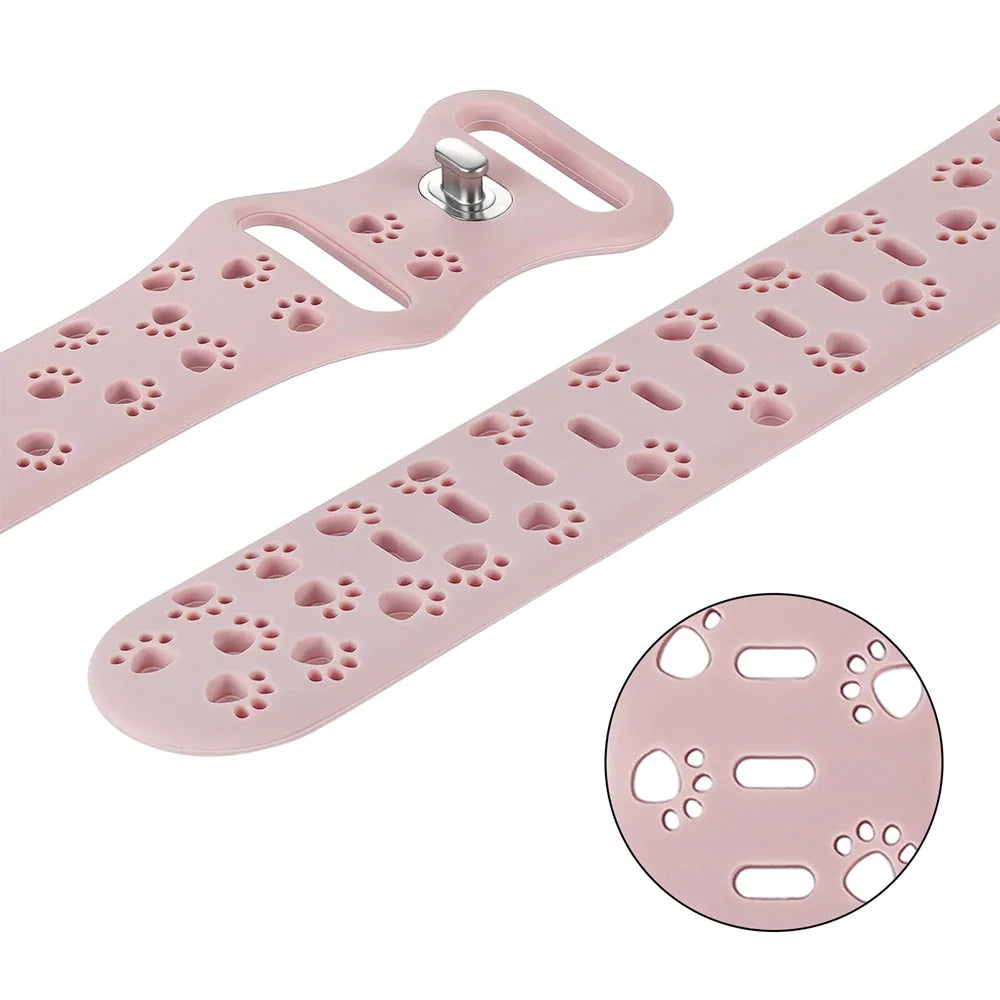 Pink silicone watch band with paw print cutouts and close-up detail