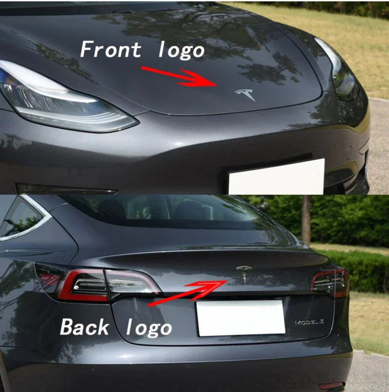 Front hood and rear trunk logos installed on a gray electric car