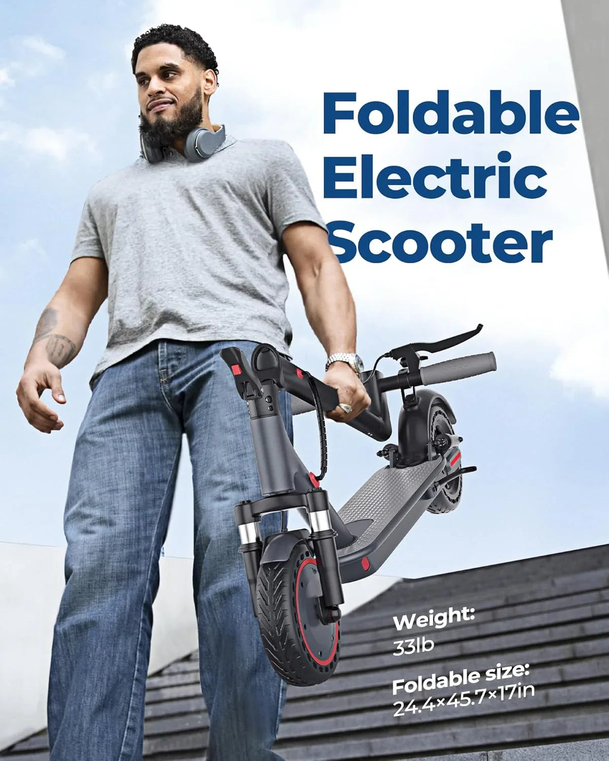 A man holding a foldable black electric scooter while standing outdoors.