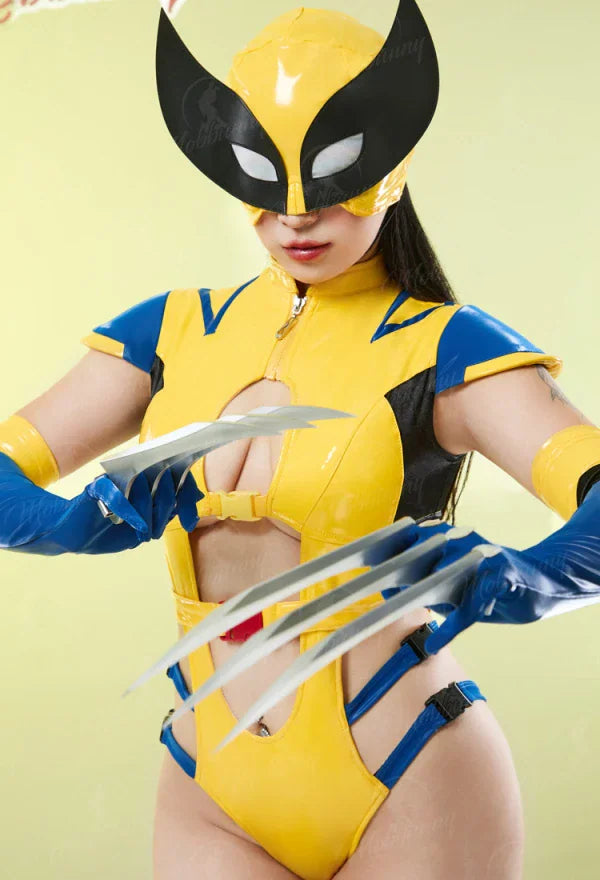 Close up of a model wearing a superhero yellow and blue cutout bodysuit costume with mask and claw props