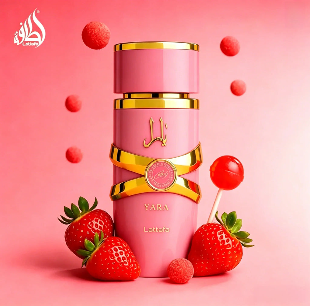 Pink bottle of Yara Candy Eau de Parfum with strawberries and lollipops on a pink background