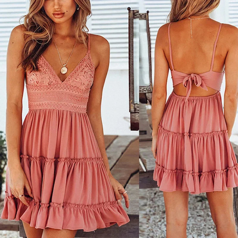 Pink sleeveless mini dress with lace bodice, spaghetti straps and open back with tie