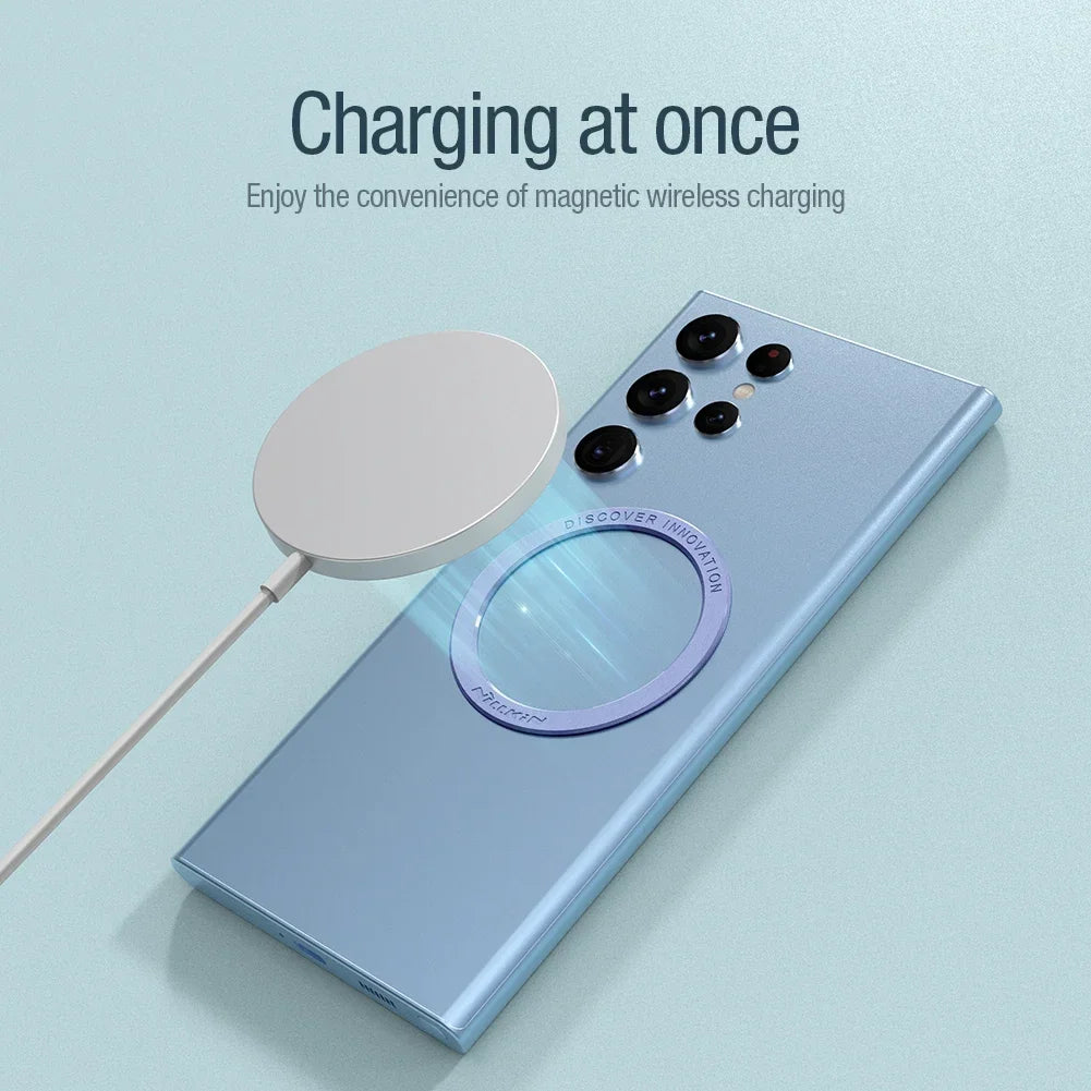 Smartphone with a purple magnetic ring attached charging on a wireless magnetic charger