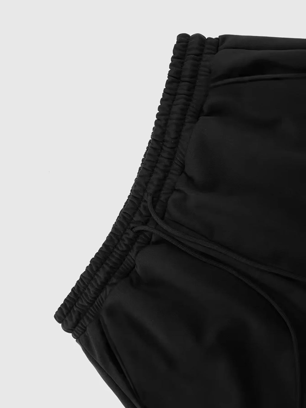 Close-up of black elastic sweatpants waistband