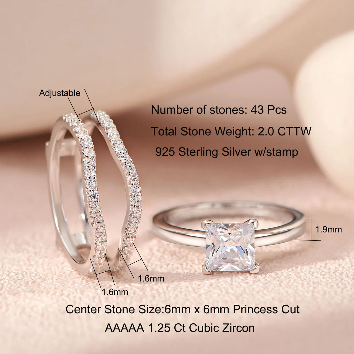 Detailed view of sterling silver rings with princess cut cubic zirconia stones and size dimensions.