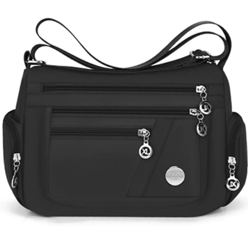 Black nylon crossbody shoulder bag with silver hardware