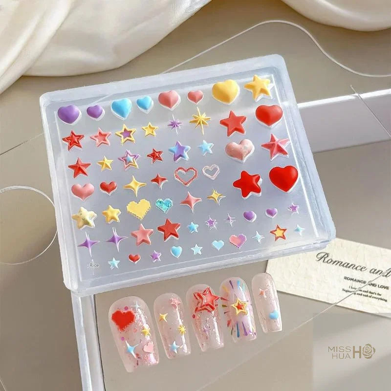 Transparent silicone mold for 3D heart and star nail art decorations with finished sample nails